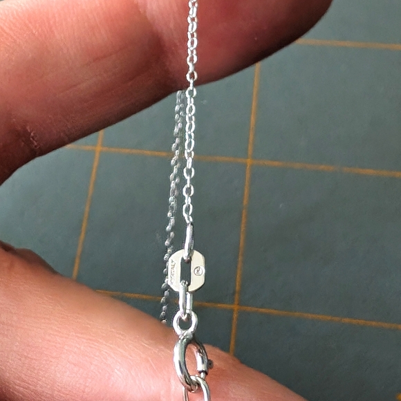 Sterling Silver Round Cut Sparkling Blue Topaz Infinity Pendant Necklace - Picture 9 of 9